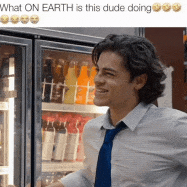 a man is smiling in front of a fridge that says what on earth