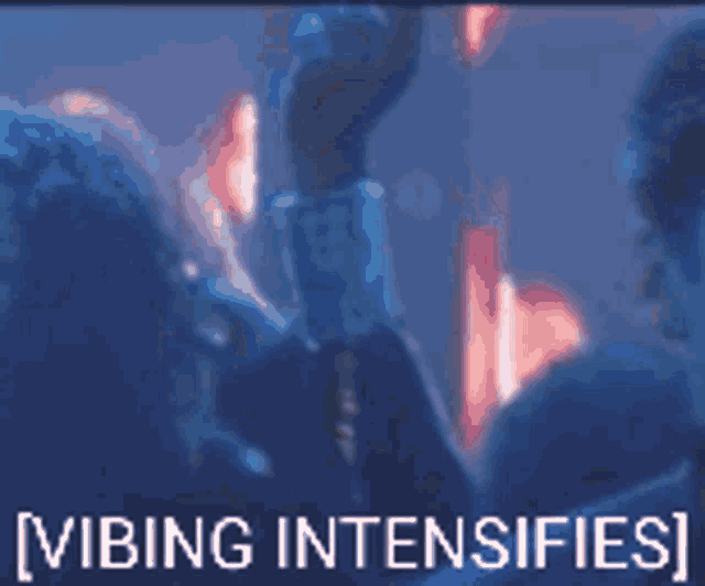 a blurred image of a crowd with the words vibing intensifies on the bottom