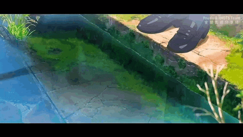 a person is standing on a rock overlooking a pond