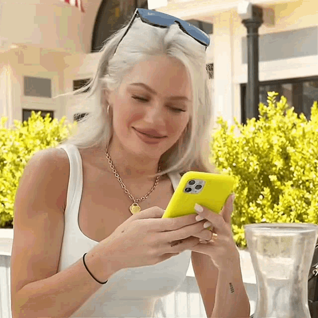 Checking Phone Laughing GIF