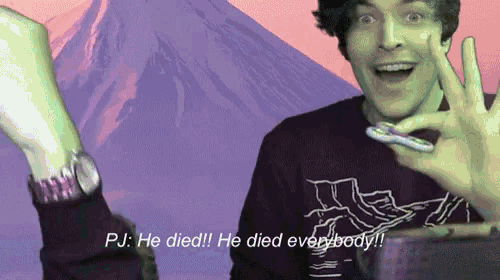 a man holding a fidget spinner with the words pj he died he died everybody