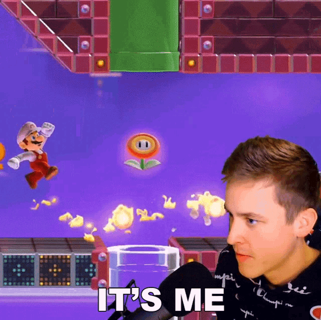 a man playing a video game with the words " it 's me "