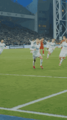 a soccer player wearing a white jersey that says unisex