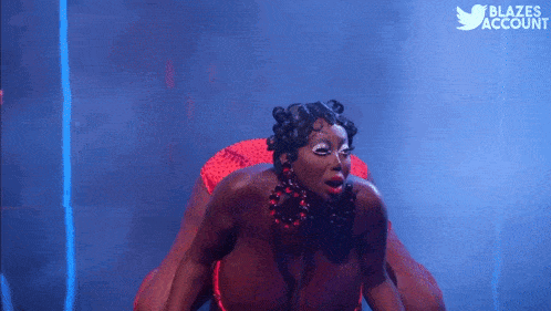 a woman is dancing in front of a twitter logo that says ' blazes account '