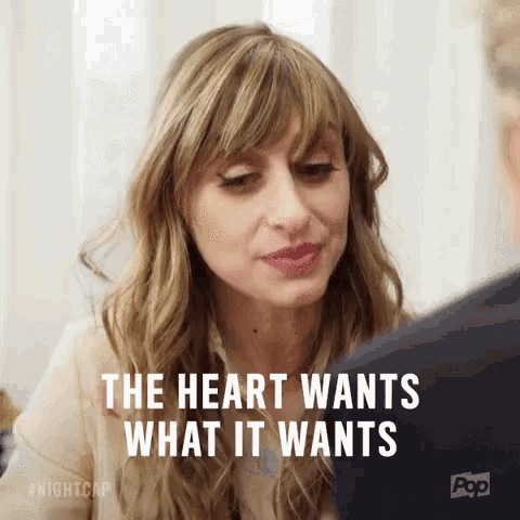 a woman is talking to a man and says the heart wants what it wants