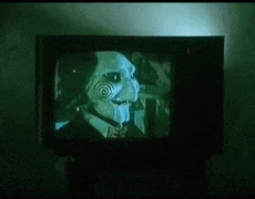 a picture of a puppet on a television with the caption shall we watch a movie