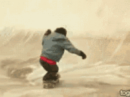 a person is riding a snowboard down a ramp and the word tog is on the bottom right