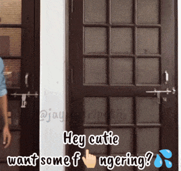 a man standing in front of a door with the words hey cutie want some f ngering below him
