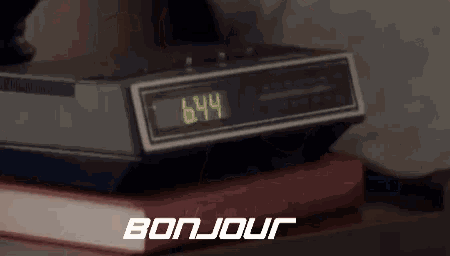 a woman is sleeping in a bed with the words bonjour written on the bottom