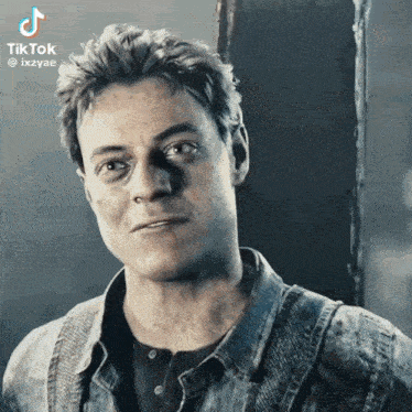 a close up of a man 's face with the hashtag tiktok