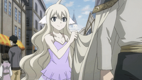 a girl in a purple top is holding a white cloth