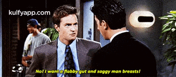 a man in a suit and tie is talking to another man in a suit and tie