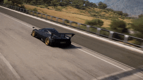 a black sports car is driving down a road with a license plate that says ' lcw ' on it