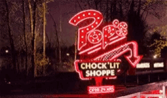 a neon sign for pop 's chock ' lit shoppe