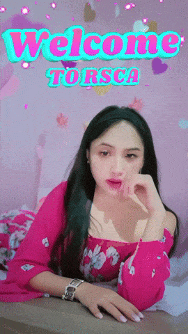 a woman in a pink dress is laying on a bed with the words welcome torsca behind her
