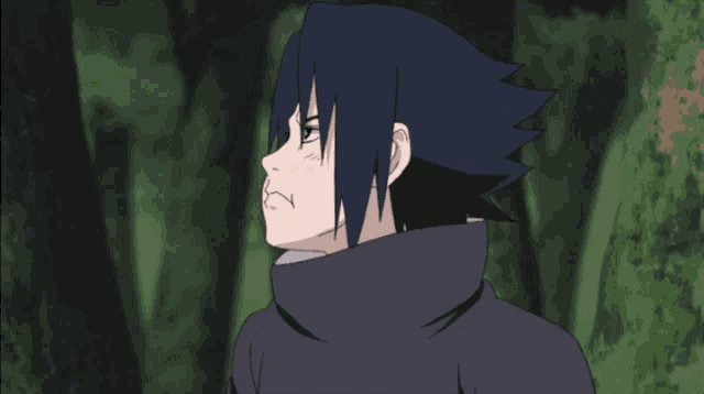 a young boy with black hair and a black sweater
