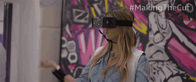 a woman wearing a virtual reality headset with the hashtag #making the cut on the bottom