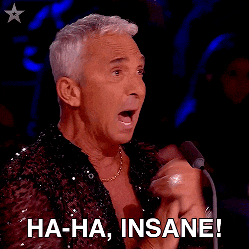 a man sitting in front of a microphone with the words ha-ha insane written below him