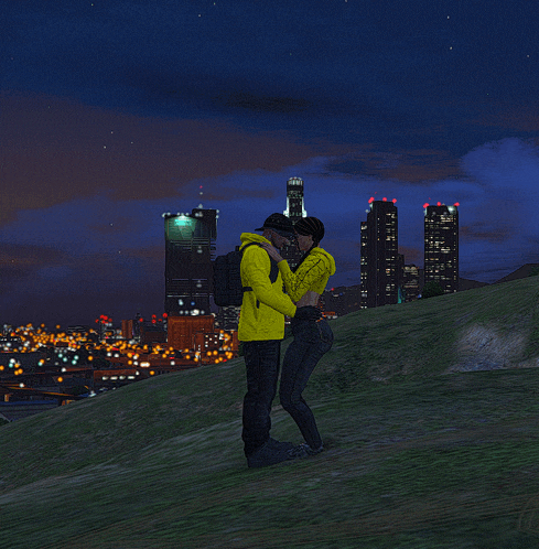 a man and woman are kissing in front of a city skyline