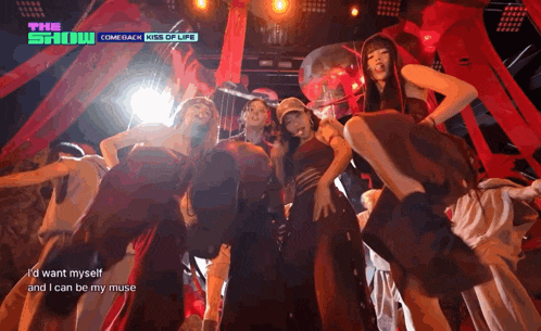 a group of people dancing on a stage with the show comeback kiss of life on the bottom