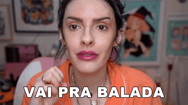 a woman with pink lipstick and the words vai pra balada on the bottom