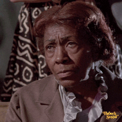 a close up of a woman 's face with the words brown sugar written on the bottom