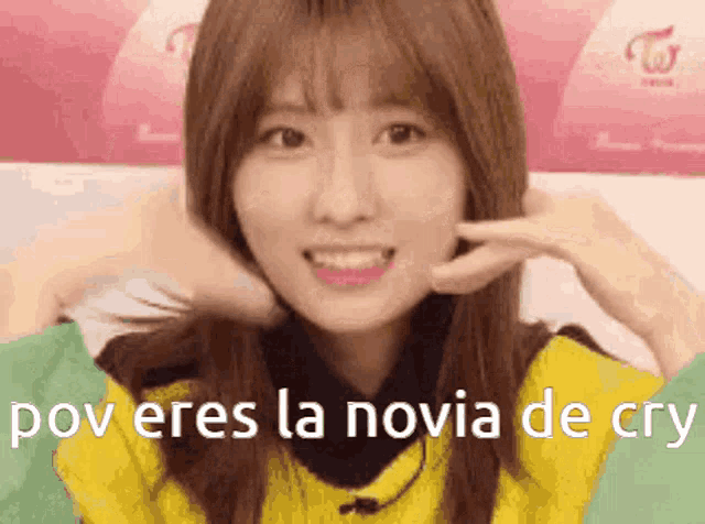 a woman is making a funny face with the words pov eres la novia de cry written on the bottom .