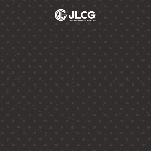 a man wearing glasses is smiling in front of a sign that says jlcg creative and digital solutions
