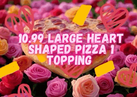 a large heart shaped pizza is surrounded by flowers