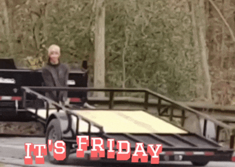 a trailer with the words " it 's friday " written on it
