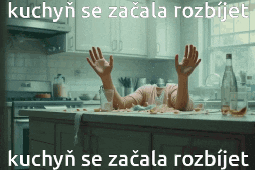 a woman laying on a messy kitchen counter with the words kuchyn se zacala rozbijet