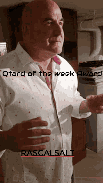 a man in a polka dot shirt is standing in front of a sign that says qtard of the week award rascalsalt