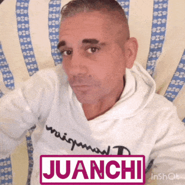 a man wearing a white hoodie with the name juanche on it