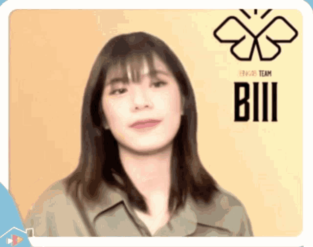 a woman is standing in front of a sign that says bill on it