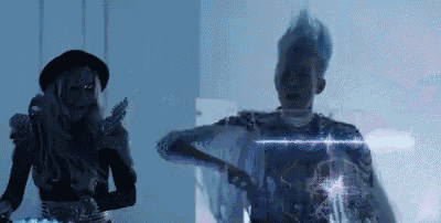 a man and a woman are dancing in a room .