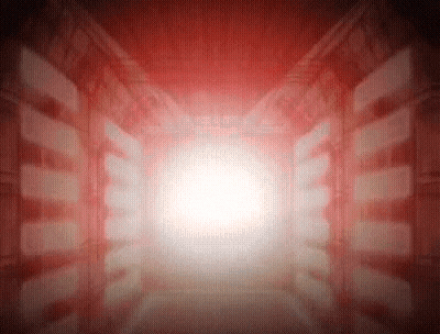 a red room with a light coming out of the end of the tunnel .