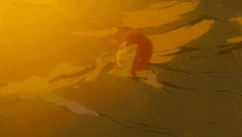 ariel from the little mermaid is swimming in a pool of water .