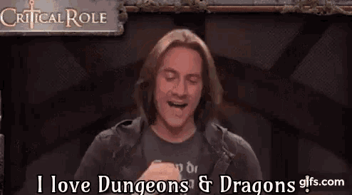 a man is sitting in front of a sign that says `` critical role '' .