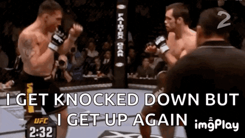 two men are fighting in a boxing ring with the words " i get knocked down but i get up again "