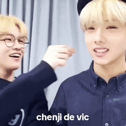 two young men are standing next to each other and one of them says chenji de vic