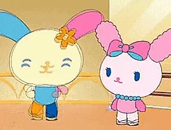 a couple of cartoon rabbits standing next to each other in a room .