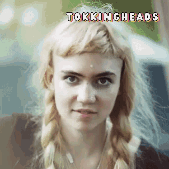 a close up of a woman 's face with the words tockingheads written above her