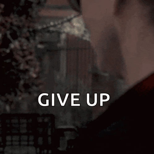a man wearing sunglasses says give up on the bottom of his face
