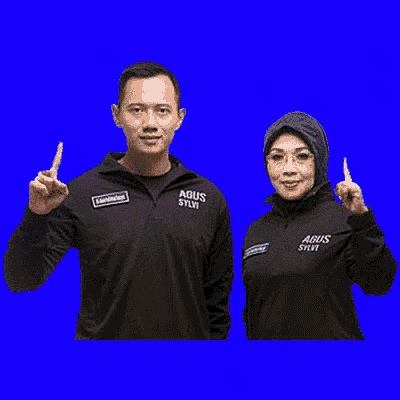 a man and a woman wearing black jackets that say agus sylvi on them