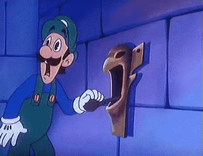 a cartoon character is holding a key in front of a door with a screaming face on it .