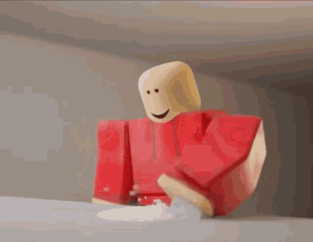 a close up of a toy being thrown in the air with snow falling on it .