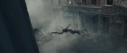 smoke coming out of a building with a blue sign that says ' a ' on it