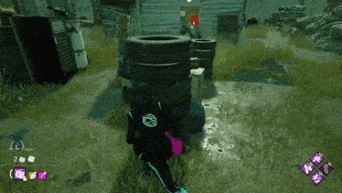 a screenshot of a video game shows a stack of tires in the grass