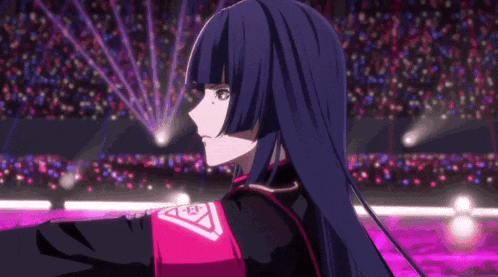 a girl with long black hair is holding a microphone in her hand .
