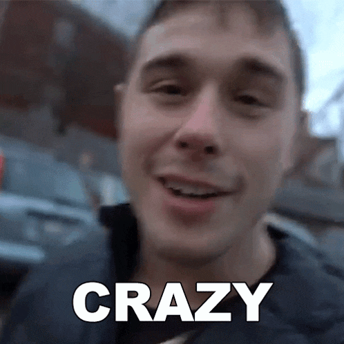 a close up of a man 's face with the word crazy in white letters